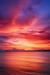 Vibrant sunset reflecting on a peaceful body of water. Suitable for various nature and travel concepts