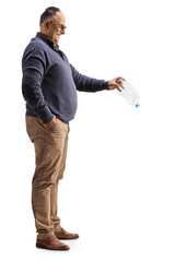 Full length profile shot of a mature man holding an empty plastic bottle