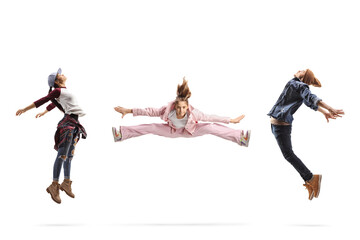 Girl leaping in the air between a male and female dancers