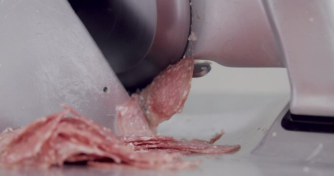 salami slicing being cut in market