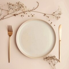 minimalist aesthetic. beige empty porcelain plate on pastel background with golden cutlery and dried flowers. 