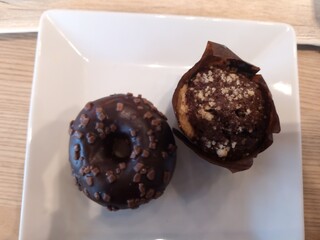Mini chocolate donut and a mini chocolate cupcake