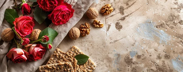 Foto op Aluminium Passover celebration concept. Matzah, red kosher and walnut. Traditional ritual Jewish bread on sand color old concrete background. Passover food. Pesach Jewish holiday. © Влада Яковенко