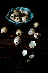 Quail eggs with one broken showing shell texture