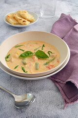 Spicy Thai coconut soup with asparagus and shrimp