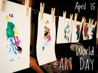 World art day April 15 poster with text and hanging abstract, colorful background artworks