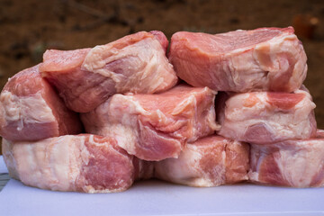 Background of raw pork tenderloins. The meat has natural colors, not too much red to attract...
