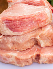 Background of raw pork tenderloins. The meat has natural colors, not too much red to attract buyers. They are sliced with different thickness. Good concepts for designing food court, groceries areas. 