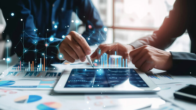 Professionals explore complex data analytics displayed on digital tablet, highlighting modern business strategy and decision-making. Business and latest analysis technologies