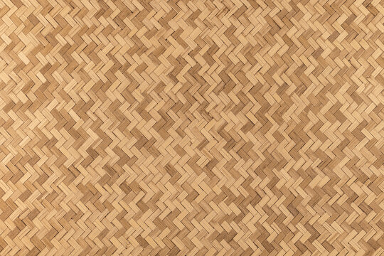 Tapis en bambou tiss&eacute; en forme de tresse pour cr&eacute;ation d'arri&egrave;re plan. Fond en fibre v&eacute;g&eacute;tale.