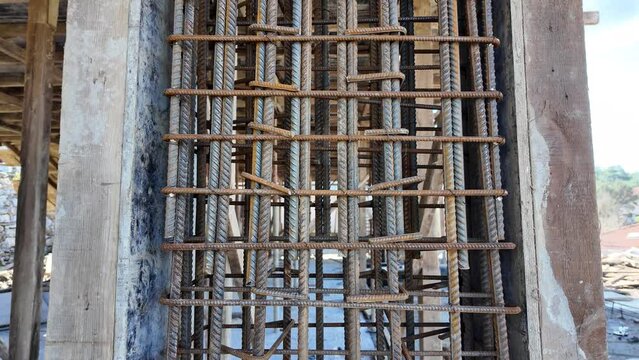 Reinforcement rebar steel rods of a column ready for concrete pouring at a construction site