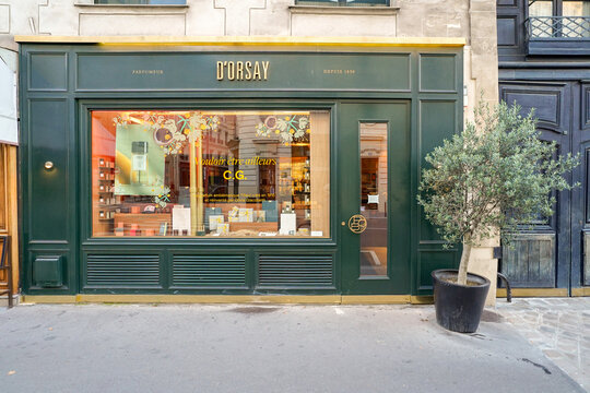 Paris France 9 july 2023 : retro traditional and typical french boutique storefront painted in green