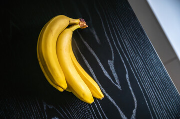 Daylight-kissed banana takes center stage on the kitchen table