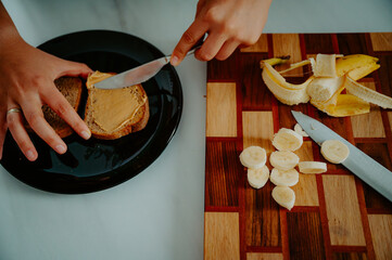 Start your day right: Nutrient-rich breakfast featuring a banana and slices of fresh bread - 747564263