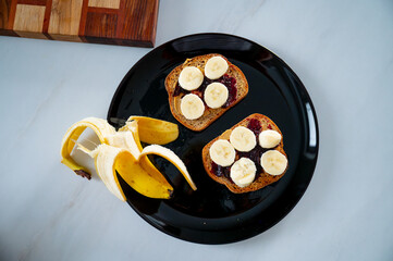 Morning delight: A wholesome breakfast with banana and toast, packed with nutrients and fiber - 747564496