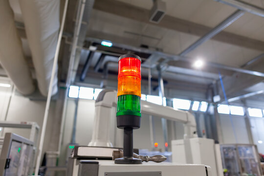 Multi-Colored Signal Tower Light Alerting Machinery Status in Industrial Setting