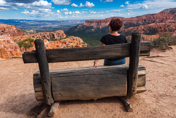 Middle-aged woman taking in the vistas in Bryce Canyon National Park, Utah.