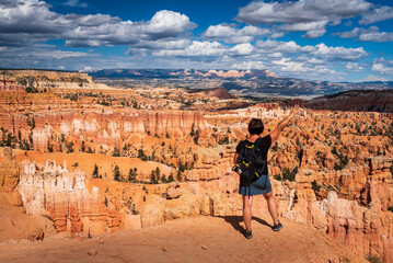 Middle-aged woman taking in the vistas in Bryce Canyon National Park, Utah.