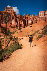 Middle-aged woman hiking the Queen’s Garden Trail in Bryce Canyon National Park, Utah.