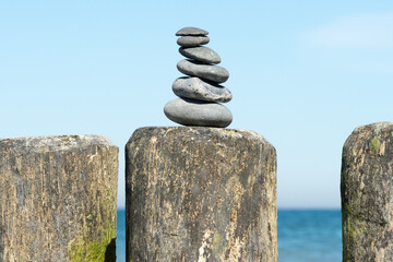 Cairns, stacked stones on the Baltic Sea coast, traditional marking for hikers