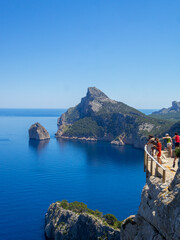 Tourists in Cap Formentor viewpoint admiring the north Maiorca coastline
