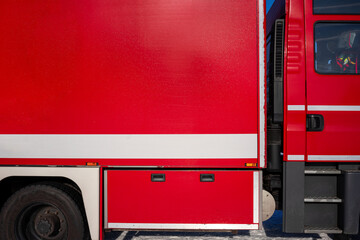 Abstract Detail of Fire Truck Side Panel in Aachener Weiher, Cologne: Vibrant Red Texture Against...