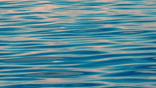 Calm ocean surface during sunset