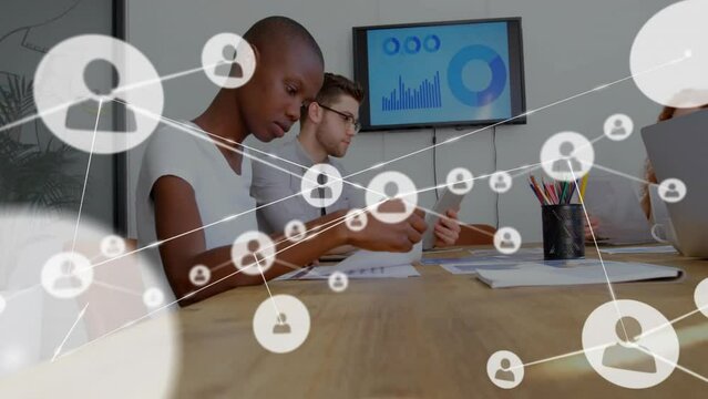 Animation of network of connections over diverse colleagues at meeting in office - Powered by Adobe