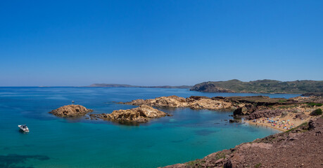 Fototapeta na wymiar Turquoise waters and small coves of Cala Pregonda, Menorca
