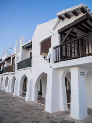 Binibeca white houses with wooden balconies, Menorca