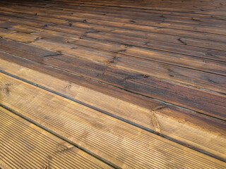 Partially painted and partly cleaned fluted wood terrace impregnated with oil. Decking of wooden...
