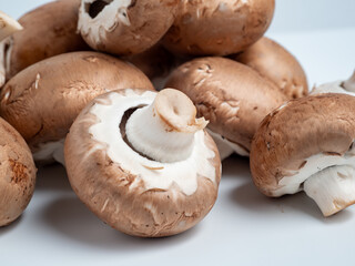 Champignon mushrooms on a white background. Champignon mushrooms close-up.