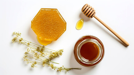 Honeycomb with flower and honey ladle on white background.
