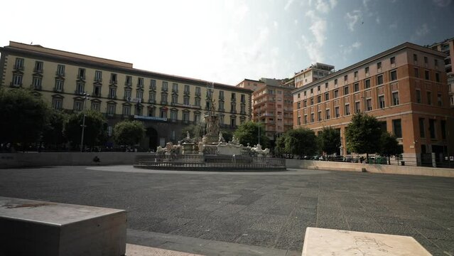 Naples, Italy - 08 02 2023 : Neptune fountain in Naples- Italy, The famous Fountain of Neptune located at Municipio square in Naples built on 1600, Idyllic fountain in public park at springtime, 