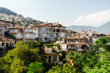 A cascade of multilevel homes nestled amidst greenery on a Mediterranean hillside