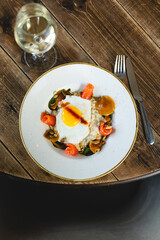 Hearty breakfast with eggs, porridge and salmon. Healthy lifestyle, lunch, brunch