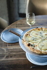 Italian pizza with pear and truffle. Restaurant serving of dishes, food photography