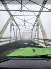 foggy bridge over the river