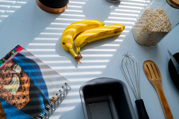 Daylit kitchen tableau with a banana as the focal point