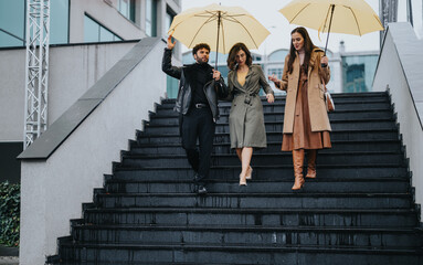 Trendy trio enjoying a casual stroll in the city with bright yellow umbrellas on a wet day,...