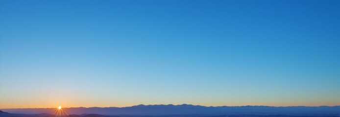Fototapeta na wymiar Sky blue background, Banner sunset over the mountains. Natural gradient background. Copy space