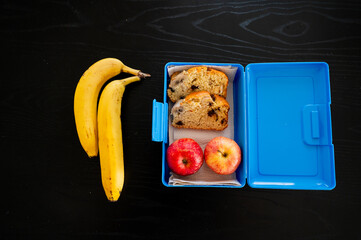 Wrap up a snack with banana, apples, and banana bread for school or work - 747595638