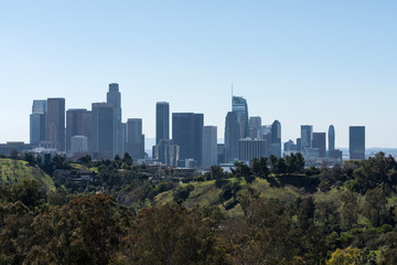 Downtown Los Angeles skyline with Elysian Park hillside in foreground.