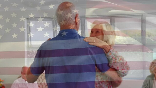 Animation of flag of usa over senior caucasian couple dancing