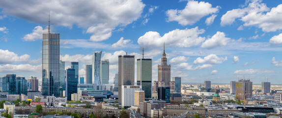 Warsaw city center, PKiN and skyscrapers under blue cloudy sky aerial landscape