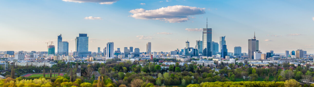 Warsaw city center, PKiN and skyscrapers under blue cloudy sky aerial landscape