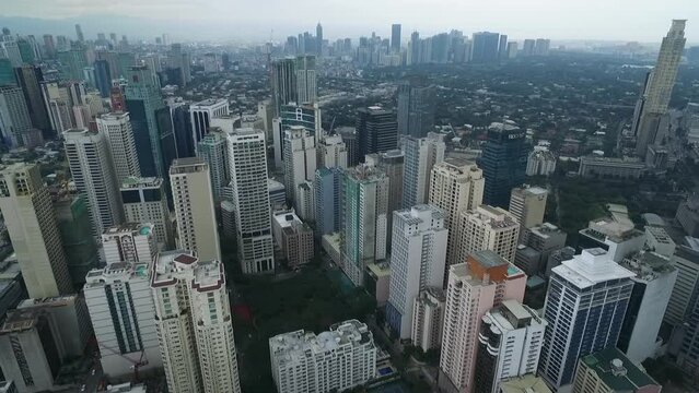 Manila Makati City in Philippines. Cityscape Skyline and Business Skyscrapers in Background. Manila Business District Traffic.