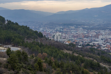 European mountain city seen from above at sunset on a cloudy day, Skopje the capital city.