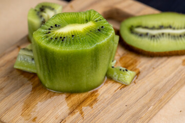 green ripe kiwi fruit on the table