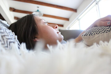 woman relaxing on couch